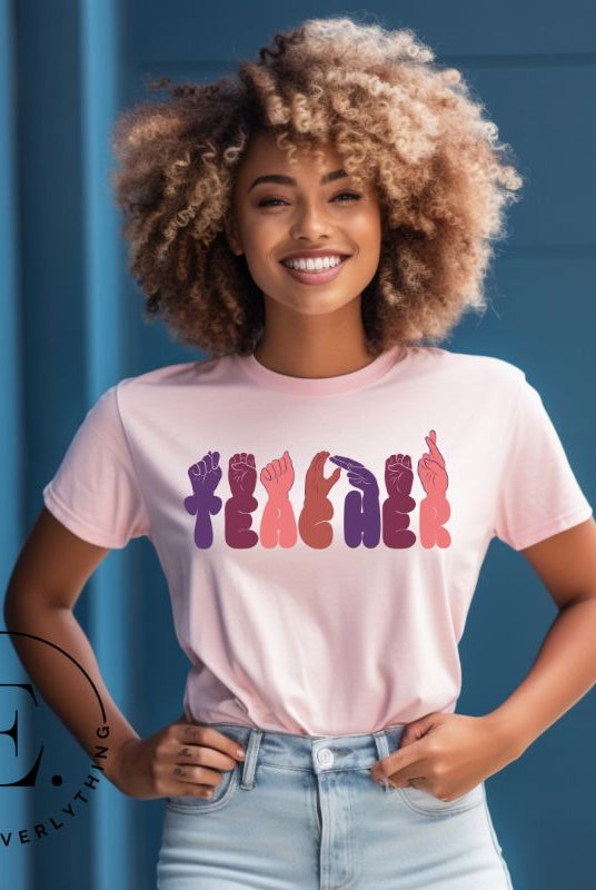 Let's celebrate our educators with this unique ASL teacher t-shirt. The word "teacher" is spelled out in American Sign Language using expertly crafted hands, highlighting their vital role in shaping our society. ASL teacher on a pink colored shirt.