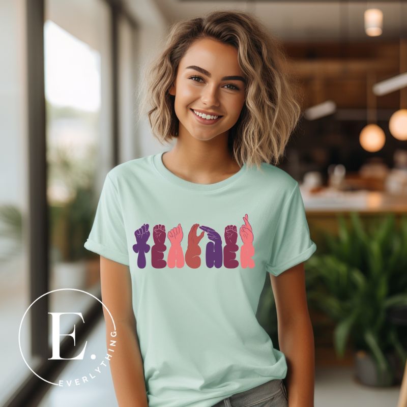 Show appreciation for educators with our downloadable PNG sublimation t-shirt design! Featuring American Sign Language (ASL) hands spelling 'teacher' this design honors the invaluable role of educators on a mint shirt. 