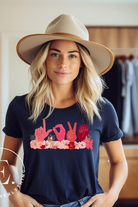 ASL hands signing love in floral flowers on a navy colored shirt.