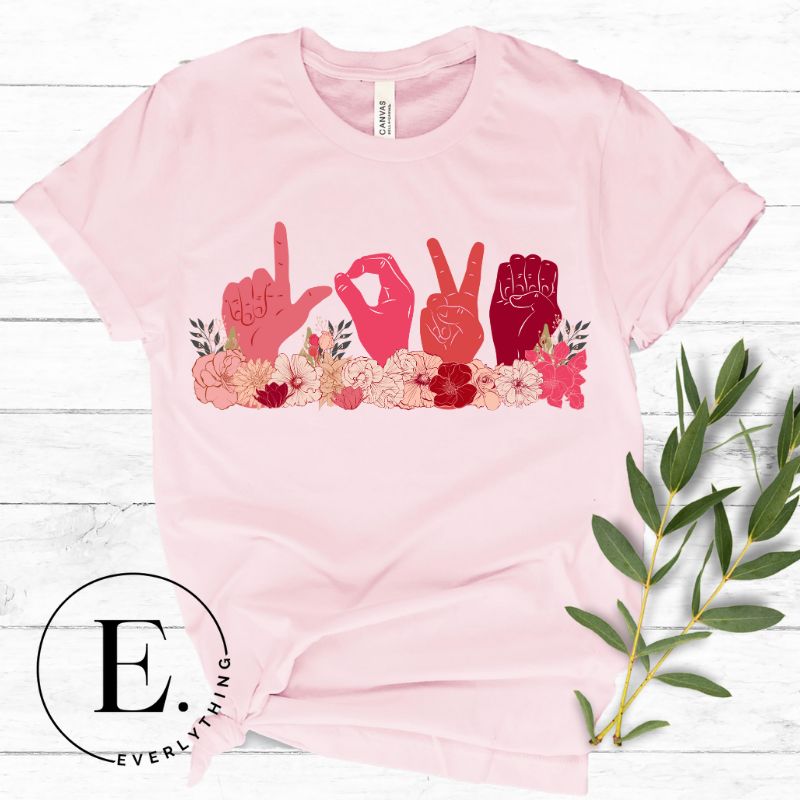 Express love in a unique way with our downloadable PNG sublimation t-shirt design! Featuring American Sign Language (ASL) hands spelling 'Love' adorned with beautiful flowers on a pink shirt.
