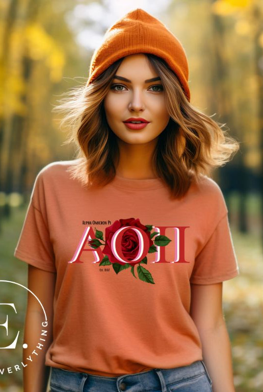 Elevate your Alpha Omicron Pi sisterhood with our premium sublimation t-shirt download. Featuring the sorority's letters and the timeless red rosa, their symbolic flower on a peach shirt. 