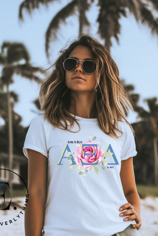 Show your Alpha Xi Delta pride with our stylish t-shirt featuring the sorority's letters and iconic pink rose on a white shirt. 