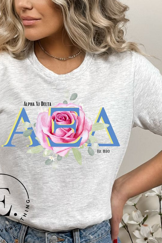 Show your Alpha Xi Delta pride with our stylish t-shirt featuring the sorority's letters and iconic pink rose on a grey shirt. 