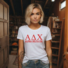 White graphic tee featuring Alpha Delta Chi letters with 'Alpha Delta Chi' written below