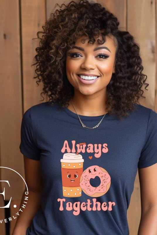 Celebrate love with our adorable Valentine's Day graphic tee! Featuring a smiling coffee cup and a cheerful donut holding hands, on a navy shirt. 