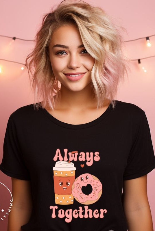 Celebrate love with our adorable Valentine's Day graphic tee! Featuring a smiling coffee cup and a cheerful donut holding hands, on a black shirt. 