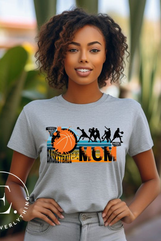 Elevate your basketball mom style with our PNG sublimation download. Create a personalized basketball mom shirt that showcases your unwavering support. PNG example on a grey shirt. 