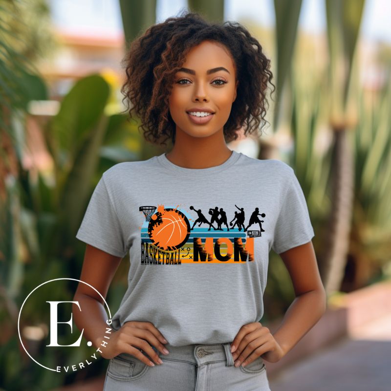 Elevate your basketball mom style with our PNG sublimation download. Create a personalized basketball mom shirt that showcases your unwavering support. PNG example on a grey shirt. 