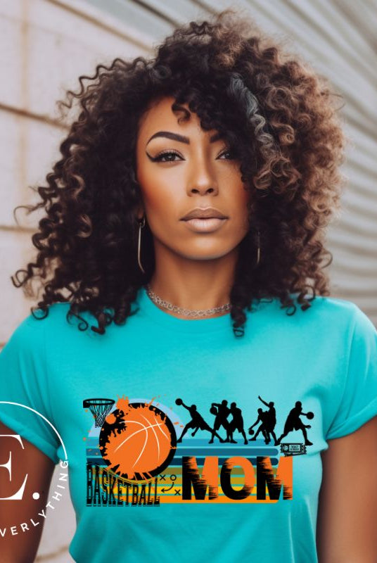 Elevate your basketball mom style with our PNG sublimation download. Create a personalized basketball mom shirt that showcases your unwavering support. PNG example on a teal shirt. 