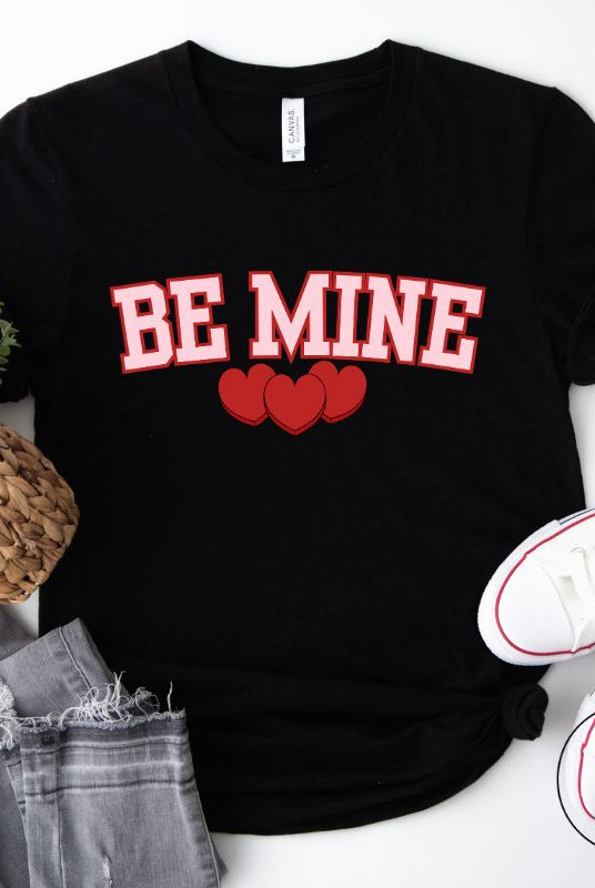 Make your Valentine's Day celebrations even more special with our PNG sublimation digital download! You can create unique and personalized shirts featuring the charming phrase "Be Mine" in a trendy and eye-catching design. Example on Be Mine PNG sublimation on a black shirt. 
