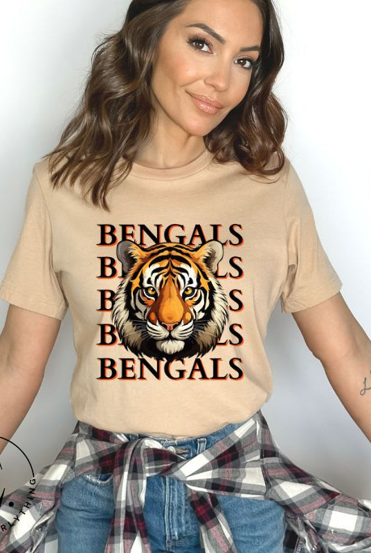 Our exclusive design features a fierce Siberian tiger face and the spirited mantra "Bengals Bengals Bengals Bengals." Unleash your inner roar with our comfortable Bella Canvas 3001 unisex graphic tee and show your stripes as a Cincinnati Bengals fan on a tan shirt.
