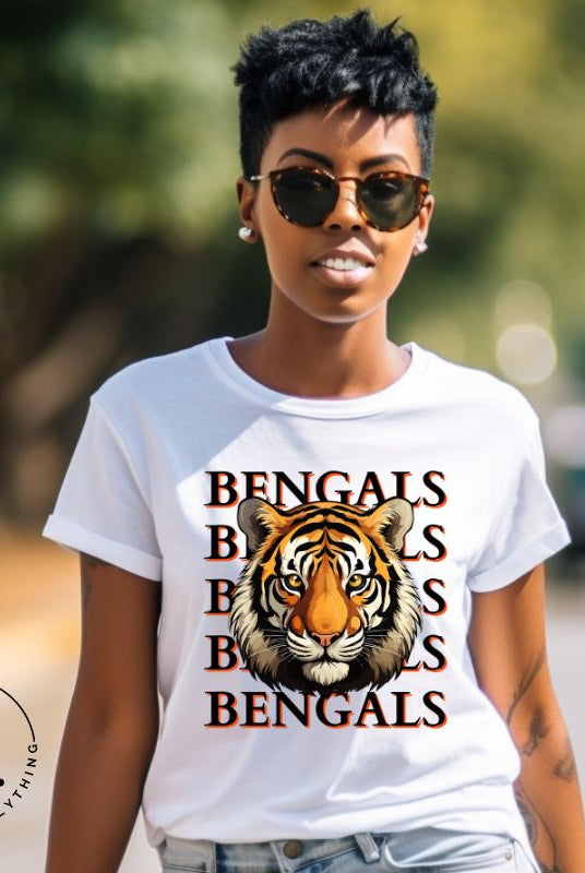 Our exclusive design features a fierce Siberian tiger face and the spirited mantra "Bengals Bengals Bengals Bengals." Unleash your inner roar with our comfortable Bella Canvas 3001 unisex graphic tee and show your stripes as a Cincinnati Bengals fan on a white shirt 