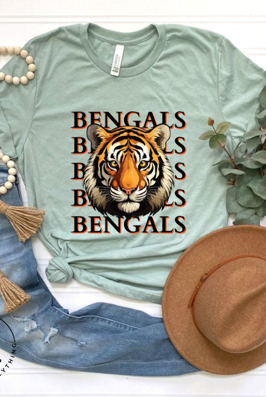 Our exclusive design features a fierce Siberian tiger face and the spirited mantra "Bengals Bengals Bengals Bengals." Unleash your inner roar with our comfortable Bella Canvas 3001 unisex graphic tee and show your stripes as a Cincinnati Bengals fan on a light green shirt. 