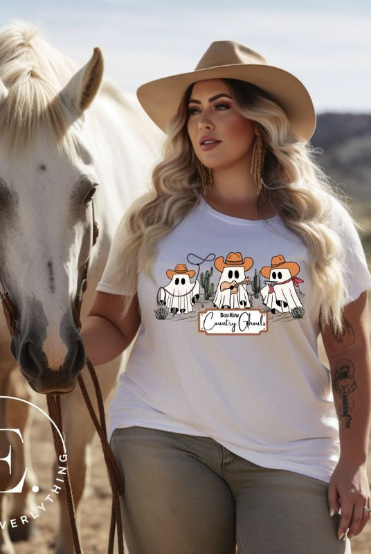 Get ready for a boot-stompin' Halloween with our country-themed PNG sublimation download. Featuring ghostly cowboys in cowboy hats, lassos, and playing country music, all accompanied by the catchy saying 'Boo-Haw Country Ghouls.' PNG example on a white shirt. 