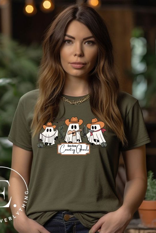 Get ready for a boot-stompin' Halloween with our country-themed PNG sublimation download. Featuring ghostly cowboys in cowboy hats, lassos, and playing country music, all accompanied by the catchy saying 'Boo-Haw Country Ghouls.' PNG example on a green shirt. 