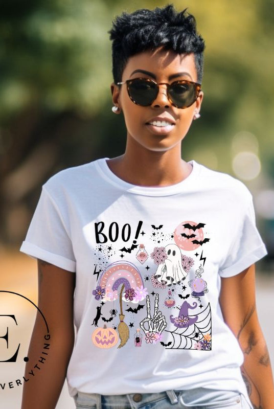 Experience the essence of Halloween with our bewitching shirt. Immerse yourself in a tapestry of Halloween symbols, from pumpkins to bats and witches, and all centered around the timeless exclamation, 'Boo!' This captivating design embodies the spirit of the season, on a white shirt. 
