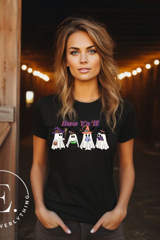 Get into the Halloween spirit with our adorable PNG sublimation download. Four cute ghost going trick-or-treating, accompanied by the playful saying 'Boo Ya'll.' PNG example on a black shirt. 