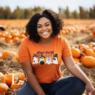 Get into the Halloween spirit with our adorable PNG sublimation download. Four cute ghost going trick-or-treating, accompanied by the playful saying 'Boo Ya'll.' PNG example on a orange shirt. 