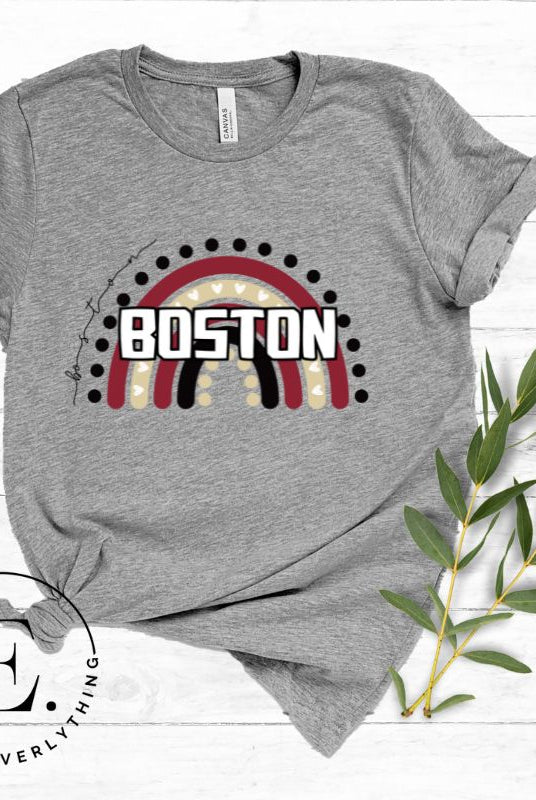 Show off your pride with this Boston College t-shirt. The iconic BC school colors stands out in this modern and trendy rainbow background, representing the school spirit. With the classic Boston wordmark across the rainbow on a grey shirt. 