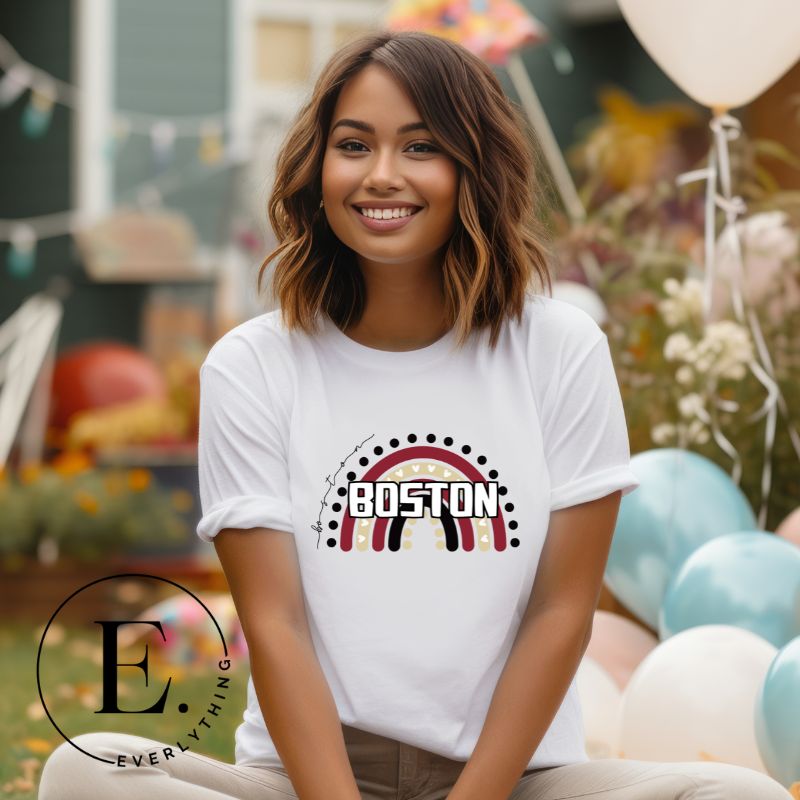 Show off your pride with this Boston College t-shirt. The iconic BC school colors stands out in this modern and trendy rainbow background, representing the school spirit. With the classic Boston wordmark across the rainbow on a white shirt. 