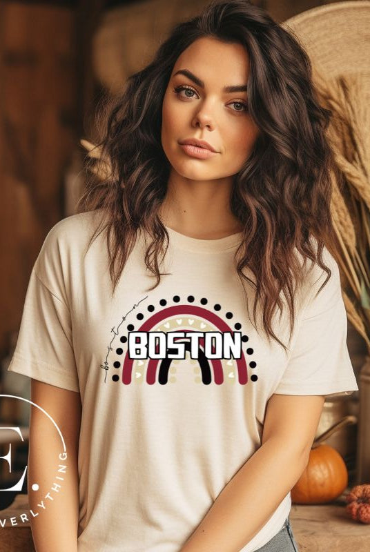 Show off your pride with this Boston College t-shirt. The iconic BC school colors stands out in this modern and trendy rainbow background, representing the school spirit. With the classic Boston wordmark across the rainbow on a soft cream colored shirt. 