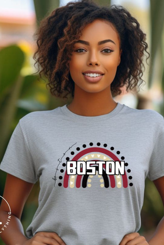 Show off your pride with this Boston College t-shirt. The iconic BC school colors stands out in this modern and trendy rainbow background, representing the school spirit. With the classic Boston wordmark across the rainbow on a grey shirt.