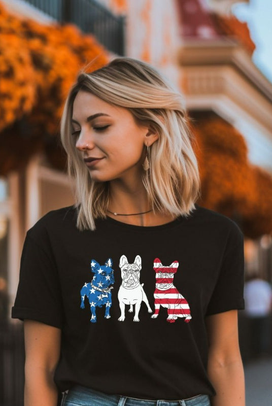 Close-up image of a USA July 4th graphic tee showcasing adorable Boston Terrier dogs posing in front of the USA flag design. A cute and patriotic design perfect for celebrating July 4th with a furry twist on a black graphic tee.