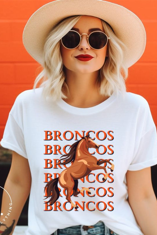 Saddle up for game day fun with our Bella Canvas 3001 unisex graphic tee! Gallop into Broncos spirit with our exclusive design featuring a lively Bronco horse and the spirited mantra "Broncos Broncos Broncos Broncos" on a white shirt. 