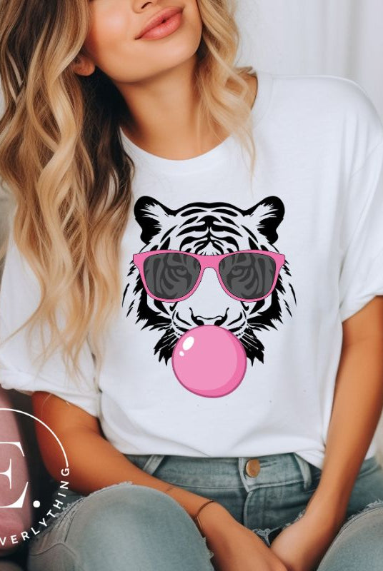 Bubble blowing tiger wearing pink sunglasses on a white shirt.