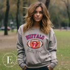 Show your Buffalo Bills pride with our premium sweatshirt featuring the team's name and iconic slogan, "Bills Mafia." On a grey sweatshirt. 