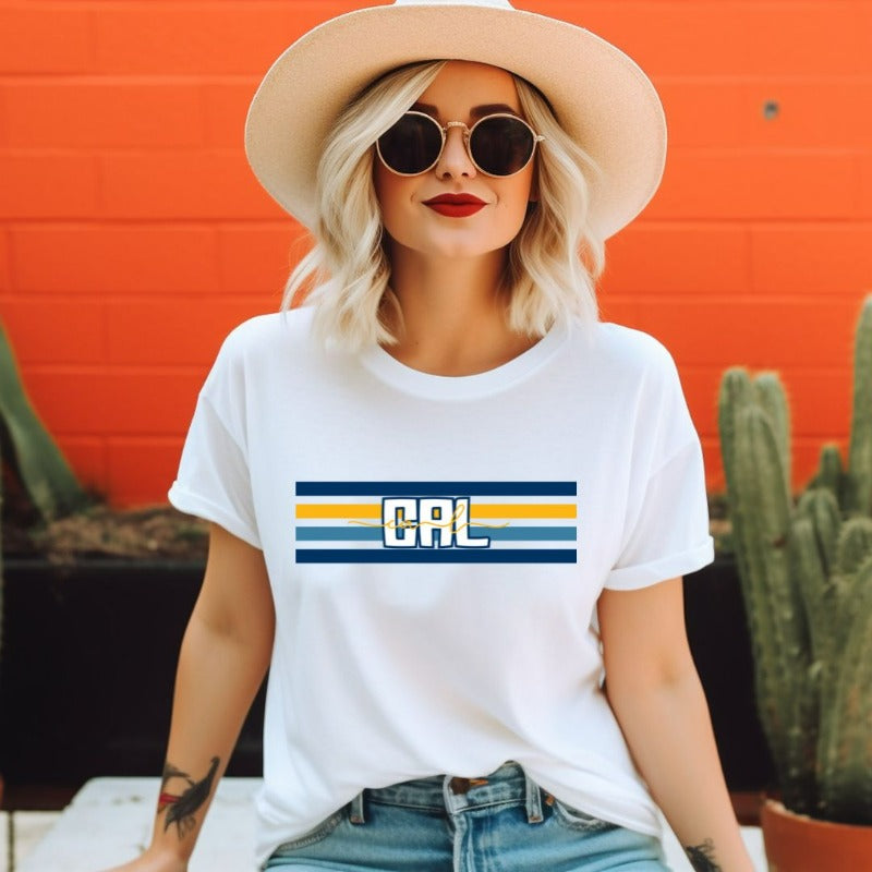 Bella + Canvas 3001 unisex t-shirt featuring blue and gold horizontal stripes with "CAL" text prominently displayed in the center on a white graphic tee.