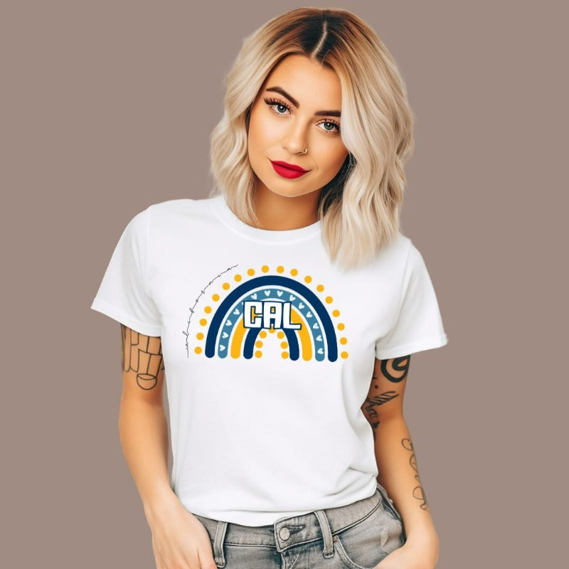 Bella + Canvas 3001 unisex t-shirt featuring a playful blue and gold rainbow design with "CAL" in the center, surrounded by hearts and dots on a white graphic tee.