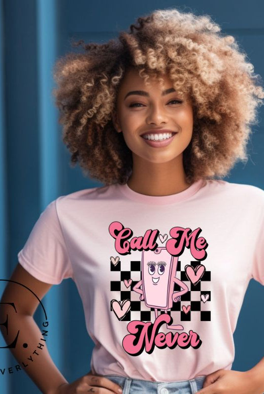 Step back in time with our retro Valentine's Day shirt. Featuring a quirky cell phone person, this tee adds a playful twist to the season of love on a pink shirt. 