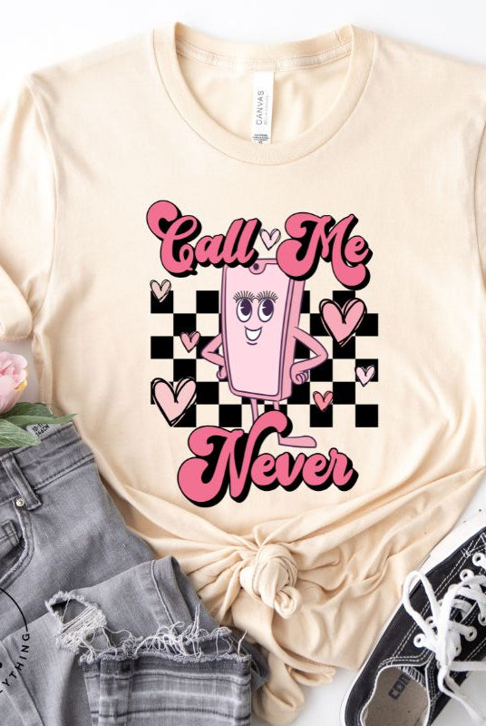 Step back in time with our retro Valentine's Day shirt. Featuring a quirky cell phone person, this tee adds a playful twist to the season of love on a soft cream shirt. 