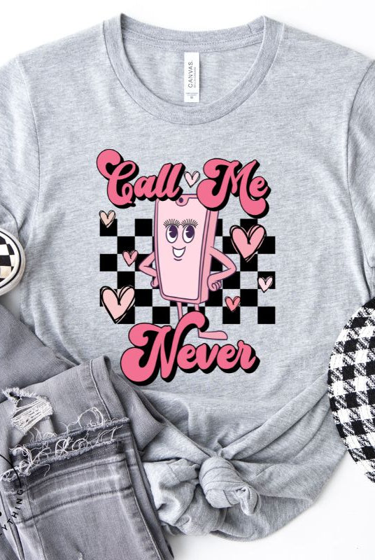Step back in time with our retro Valentine's Day shirt. Featuring a quirky cell phone person, this tee adds a playful twist to the season of love on a grey shirt. 