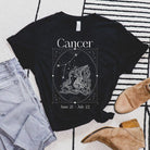 Bella + Canvas 3001 black heather Cancer Zodiac shirt featuring an intricate Cancer symbol design, constellation, and dates June 21 - July 22.