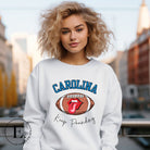 Support the Carolina Panthers in style with our modern and trendy sweatshirt featuring the team's name and powerful teams slogan, "Keep Pounding."  ON a white sweatshirt. 