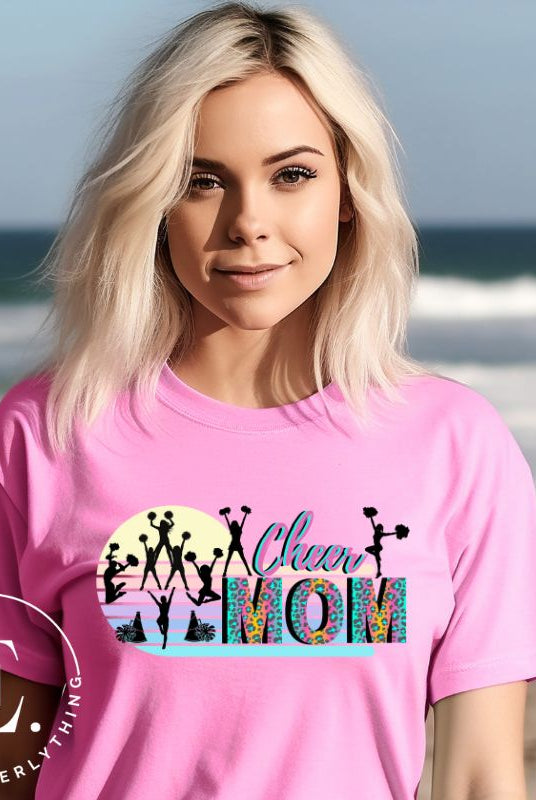 Get your cheer on with our stylish cheer mom shirt. Perfect for proud moms supporting their cheering stars. Made with love, this shirt combines comfort and fashion, letting you show off your team spirit. Join the cheer squad and cheer your heart out in style on a pink shirt. 