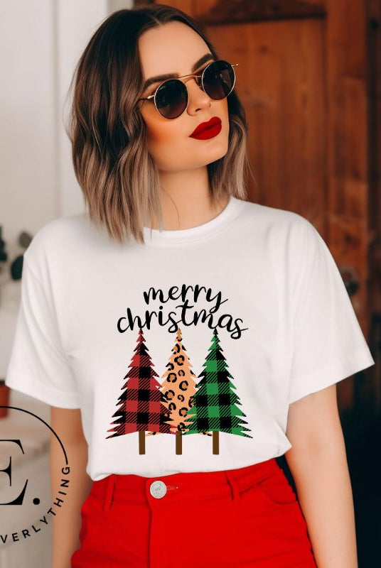 Get ready to unleash your wild side this Christmas with our unique shirt. This design is a bold and playful take on the holiday season, featuring three Christmas trees adorned with fierce cheetah print. on a white shirt. 