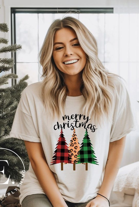 Get ready to unleash your wild side this Christmas with our unique shirt. This design is a bold and playful take on the holiday season, featuring three Christmas trees adorned with fierce cheetah print on a white shirt.