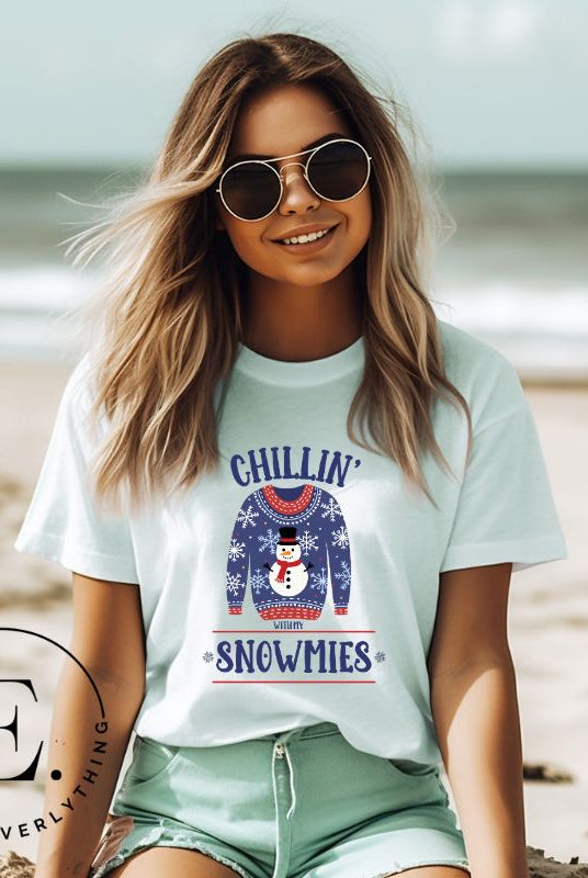 Get into the holiday spirit with our adorable Christmas sweater featuring a snowman and the playful phrase "Chillin' with my Snowmies" on mint colored shirt.