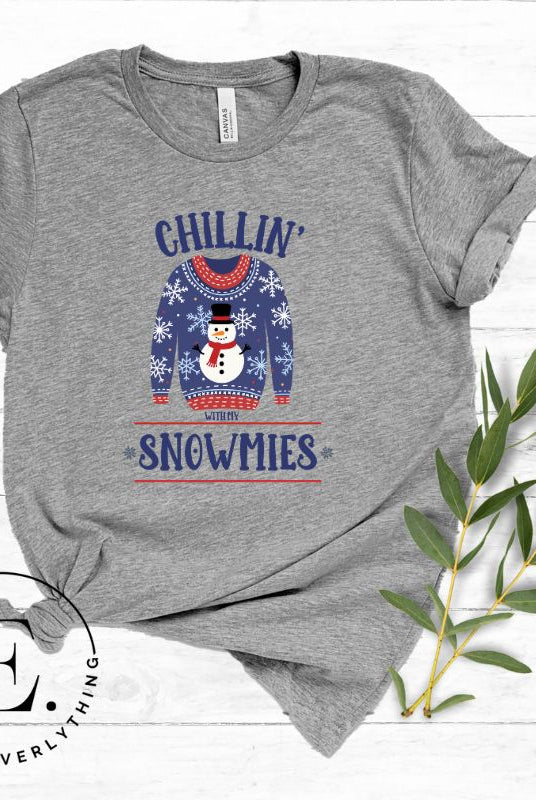 Get into the holiday spirit with our adorable Christmas sweater featuring a snowman and the playful phrase "Chillin' with my Snowmies" on grey colored shirt.
