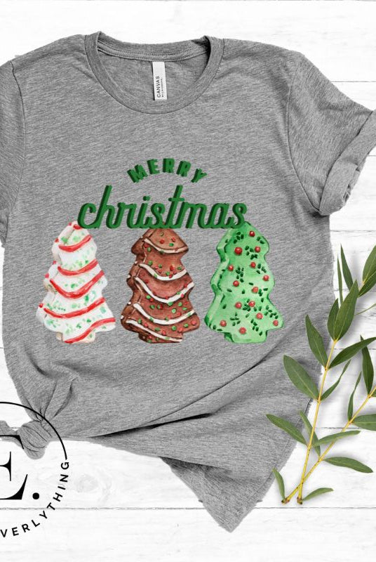 Relive the nostalgia of your childhood with our Christmas shirt that features the beloved classic Christmas tree cookies on a grey shirt. 