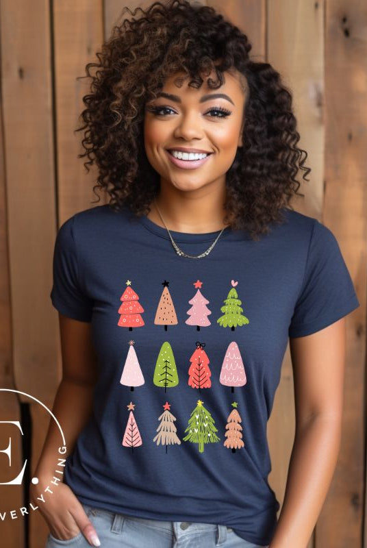 Upgrade your holiday fashion with our contemporary Christmas shirt. The shirt features three rows of multiple different modern Christmas trees in each row, creating a trendy and charming design on a navy shirt. 