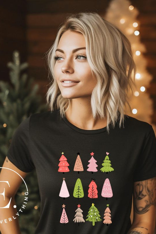 Upgrade your holiday fashion with our contemporary Christmas shirt. The shirt features three rows of multiple different modern Christmas trees in each row, creating a trendy and charming design  on a black shirt. 