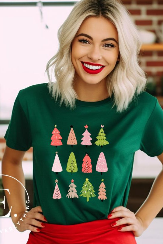 Upgrade your holiday fashion with our contemporary Christmas shirt. The shirt features three rows of multiple different modern Christmas trees in each row, creating a trendy and charming design on a green shirt. 