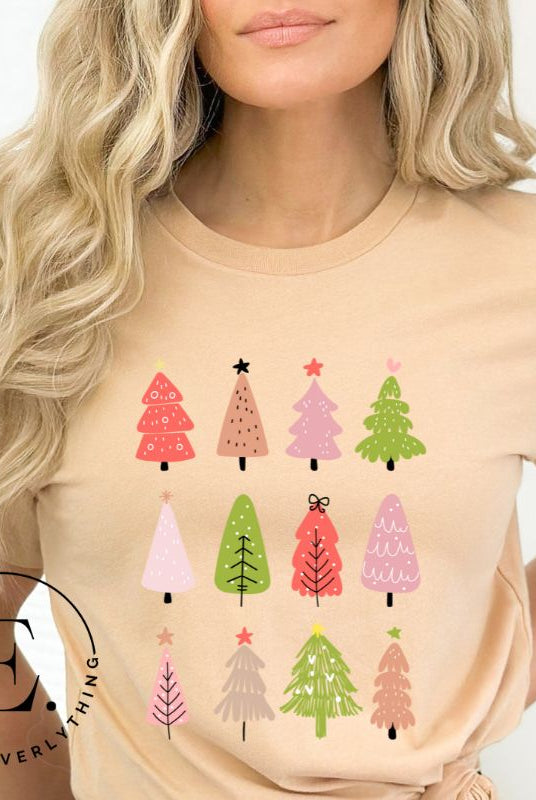 Upgrade your holiday fashion with our contemporary Christmas shirt. The shirt features three rows of multiple different modern Christmas trees in each row, creating a trendy and charming design on a tan shirt. 