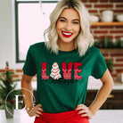 Capture the sweetness of the season with our downloadable Christmas PNG sublimation t-shirt design! The word 'love' is beautifully adorned with a classic Christmas tree cake, adding a delicious touch to your holiday style on a green colored shirt. 