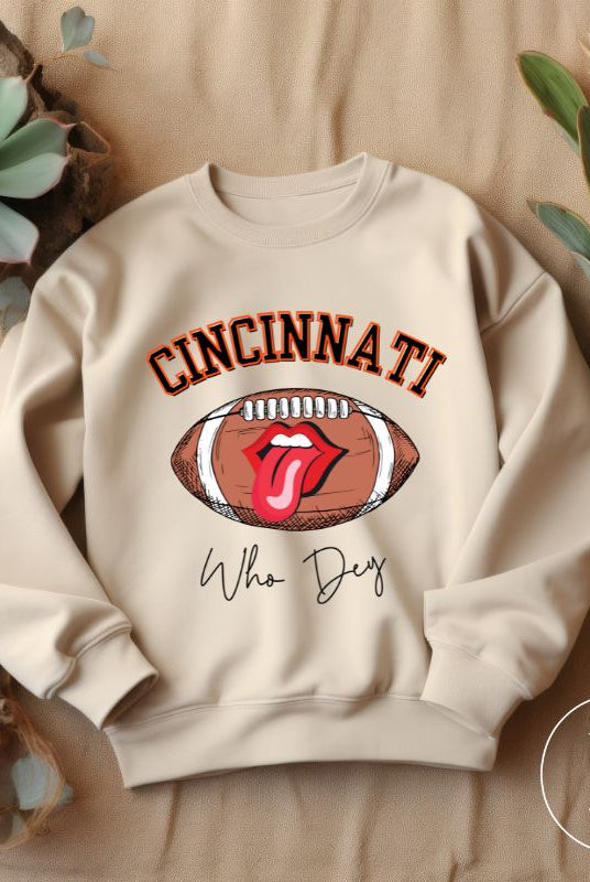 Gear up and show your support for the Cincinnati Bengals with our premium sweatshirt featuring the team's name and rallying slogan, "Who Dey." On a sand colored sweatshirt. 