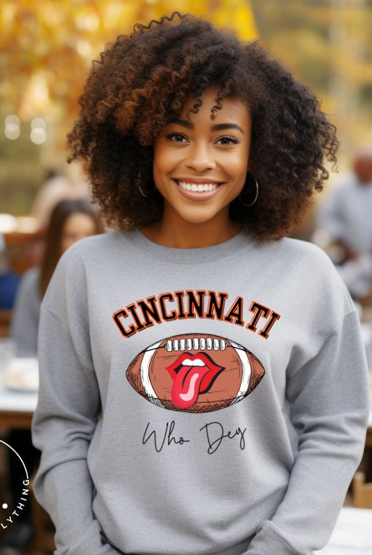 Gear up and show your support for the Cincinnati Bengals with our premium sweatshirt featuring the team's name and rallying slogan, "Who Dey." On a grey sweatshirt. 